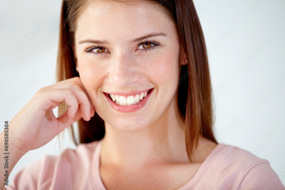 Portrait, face and young woman in studio with smile for break, rest or confident personality on white background. Beautiful model in good mood, pride and happy to relax for optimism in New Zealand Portrait, face and young woman in studio with smile for break, rest or confident personality on white background. Beautiful model in good mood, pride and happy to relax for optimism in New Zealand