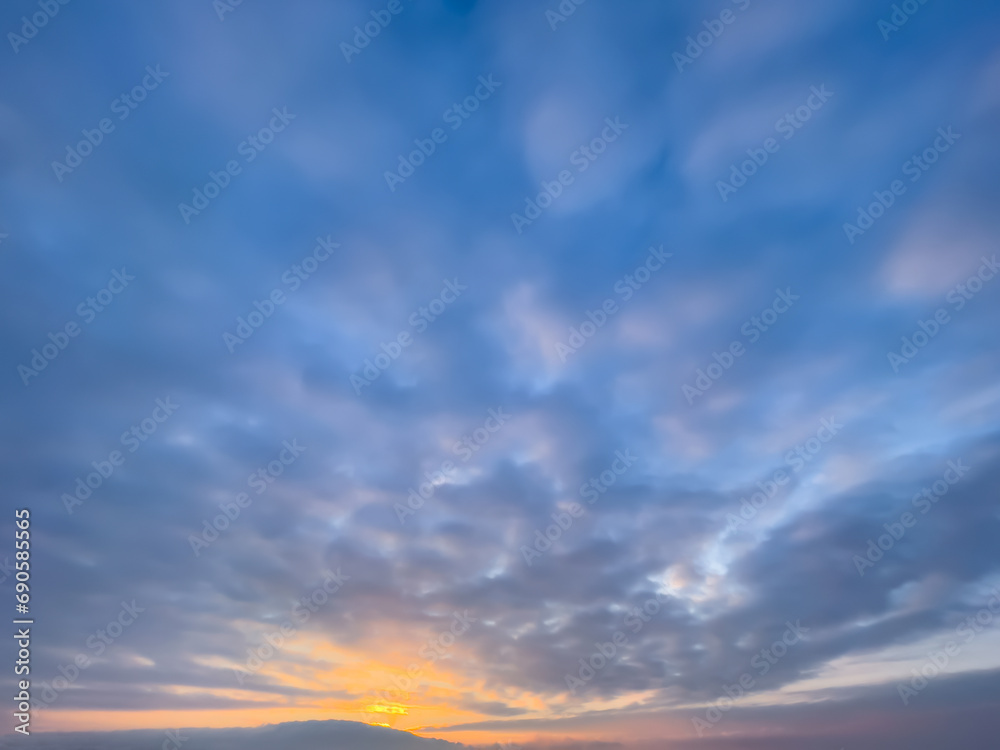Colorful, sunny sunset, sunrise in a clear sky. Abstract background. Cloudy sky. The clouds. Natural background. Copy space Colorful, sunny sunset, sunrise in a clear sky. Abstract background. Cloudy sky. The clouds. Natural background. Copy space