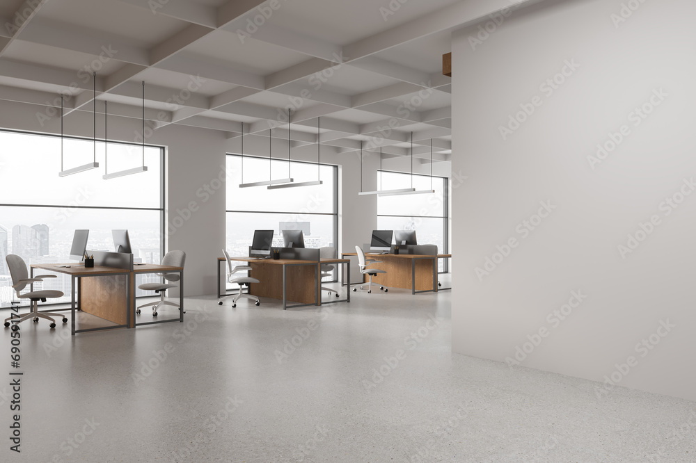 White open space office corner with blank wall White open space office corner with blank wall