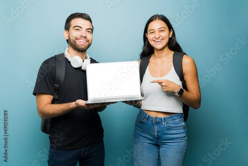 Tableau sur toile Portrait of beautiful hispanic couple studying university online
