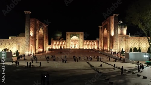 Drone panorama of the illuminated Registan complex at night, Samarkand, Uzbekistan photo