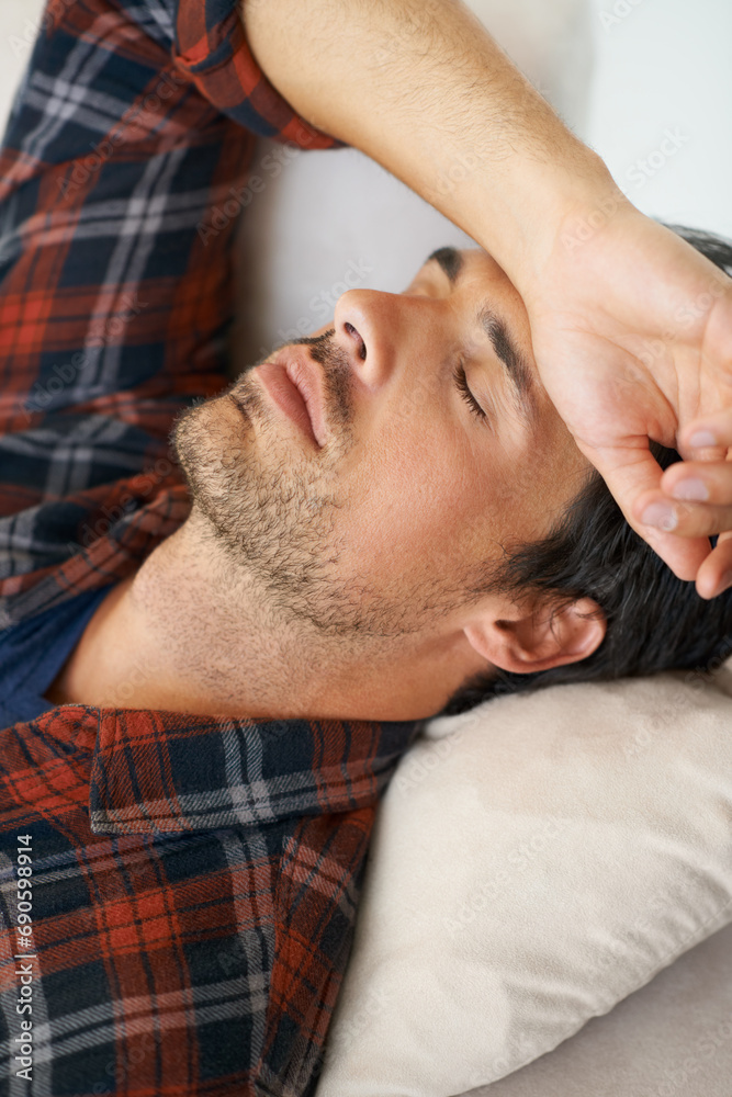Rest, sleeping and man on sofa in home for afternoon nap, relax and calm in living room. Asleep, eyes closed and face closeup of tired person on couch lying for fatigue, comfortable and wellness Rest, sleeping and man on sofa in home for afternoon nap, relax and calm in living room. Asleep, eyes closed and face closeup of tired person on couch lying for fatigue, comfortable and wellness