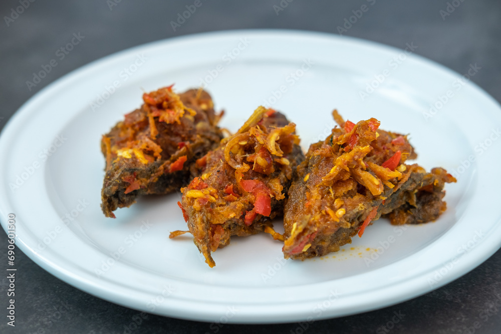 Traditional Thai spicy stir-fried catfish with curry paste Southern food, traditional recipe