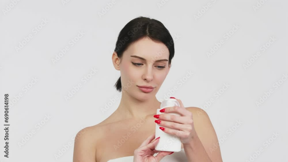 Women's cosmetic procedures. Young attractive, charismatic woman shower gel or hygiene product. The concept of advertising cosmetology services and care cosmetics. Women's cosmetic procedures. Young attractive, charismatic woman shower gel or hygiene product. The concept of advertising cosmetology services and care cosmetics.