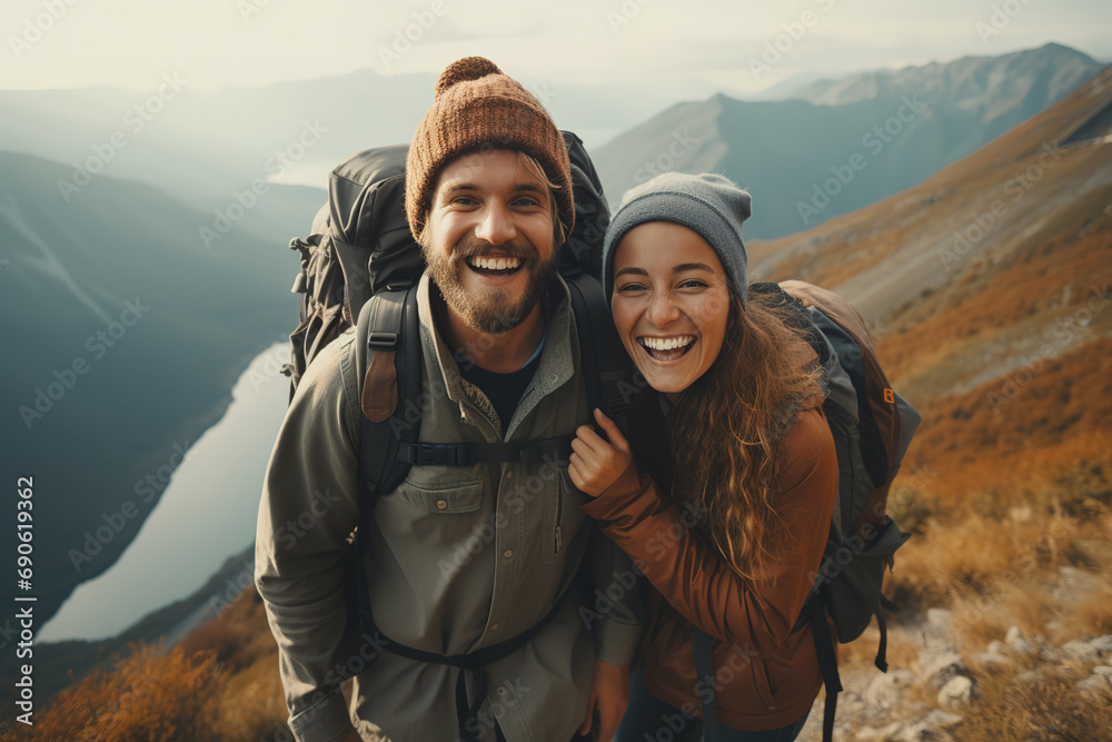 Happy couple hiking and having fun in the mountains.