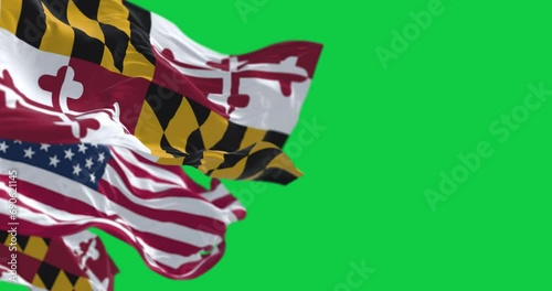 Flags of Maryland and of the United states waving in the wind on green screen photo