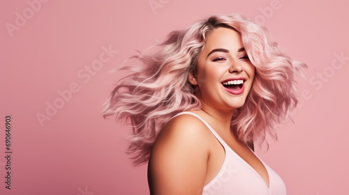 girl smiling on a pink background.