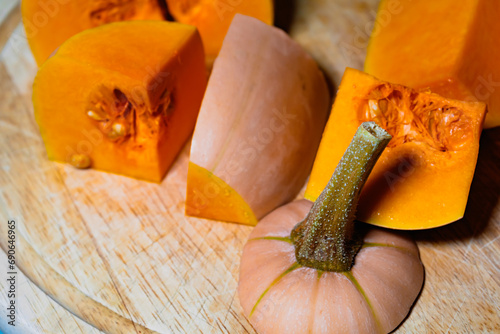 Butternut cut into pieces, squash slices with seeds, cucurbita moschata photo