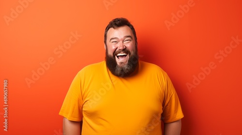 laughing fat obese man in yellow shirt.