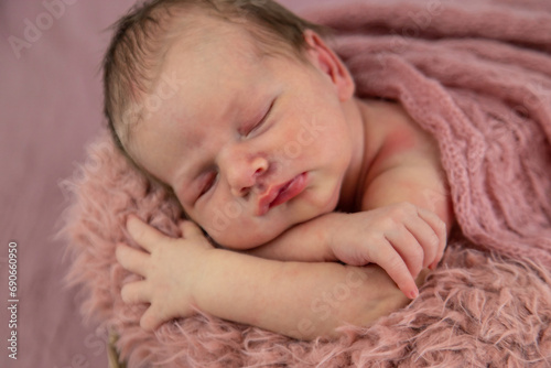 beautiful sleeping girl. A newborn girl is sleeping. © Anna