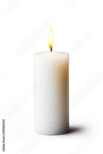 A single, unlit candle isolated on white background
