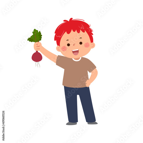 Kid boy holding fresh beetroot in hand