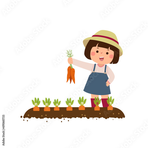 Little girl farmer harvesting carrots in the garden