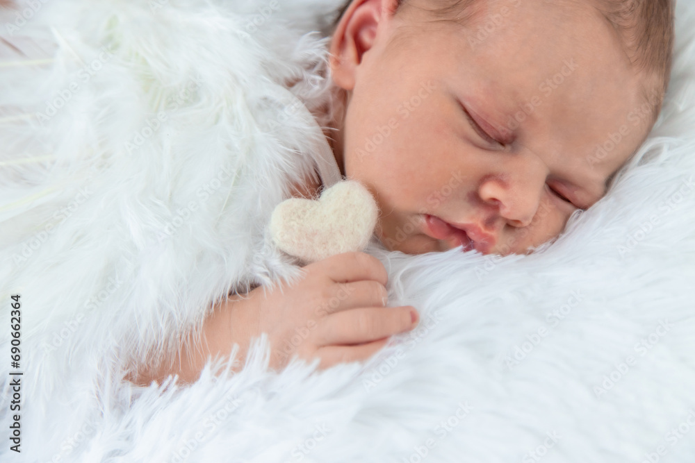 Newborn angel photo session in a suit. Selective focus Newborn angel photo session in a suit. Selective focus