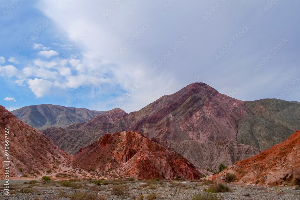 Picturesque hill of seven colors, Purmamarca, Argentina, mountain range with colorful purple and orange colors.