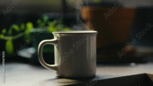 Hot coffee mug in the morning. Delicious drink to start the day. Steaming hot beverage.