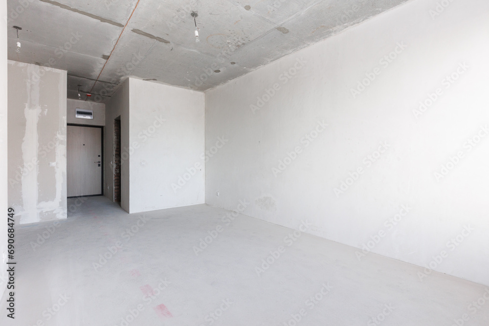 interior of the apartment without decoration in gray colors. rough finish interior of the apartment without decoration in gray colors. rough finish