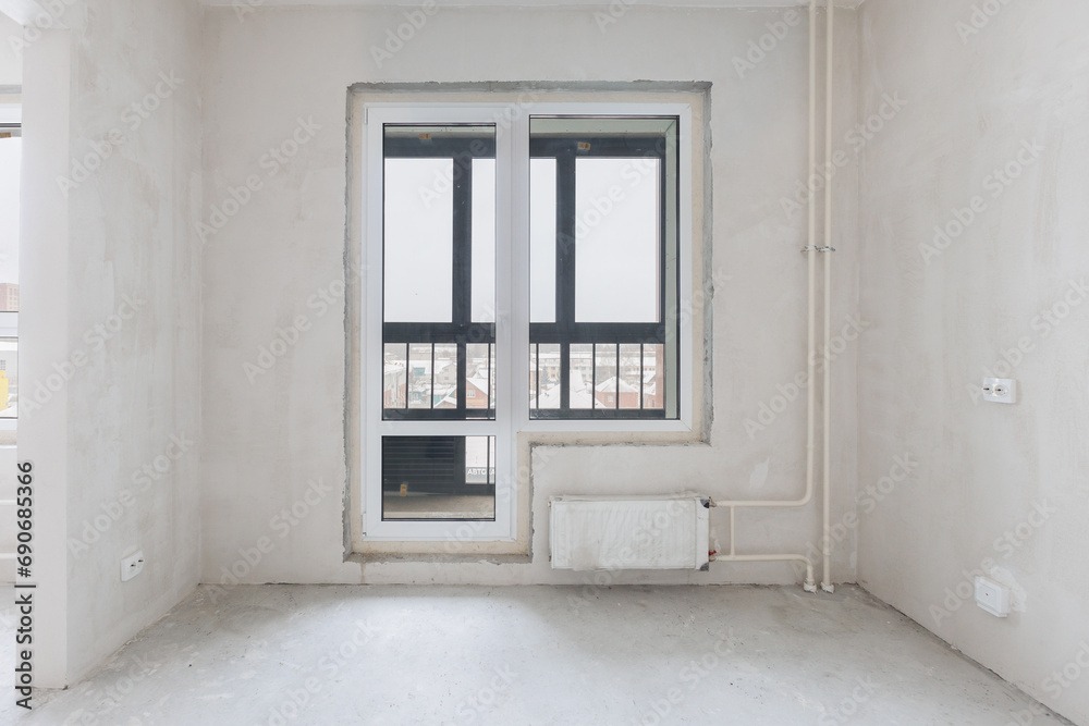 Fototapeta premium interior of the apartment without decoration in gray colors. rough finish