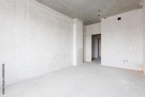 interior of the apartment without decoration in gray colors. rough finish