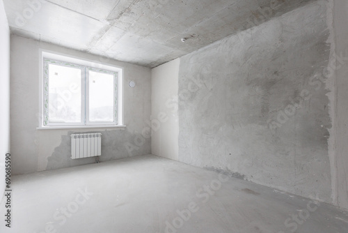 interior of the apartment without decoration in gray colors. rough finish