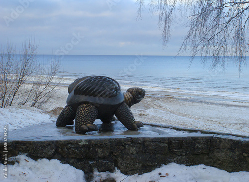 View of the turtle sculpture and sea on a winter day. Close-up. Jurmala.The Baltic States. photo