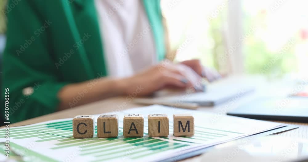 Person types a letter on computer demanding financial refund. Compensation for non-pecuniary damage concept