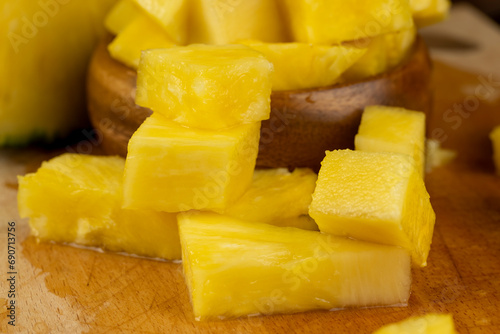 sliced ripe yellow pineapple, a large number of pieces