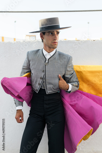 Confident matador standing near arena