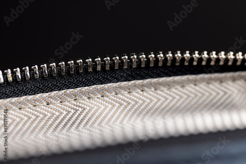 zipper on a black women's handbag close-up © rsooll