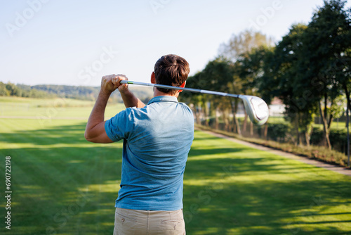 Golfing Enthusiast Swinging Club Outdoors