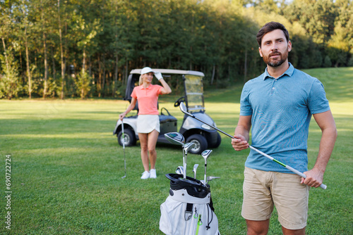 Golf Course Serenity: Couple Engrossed in Golf Activities
