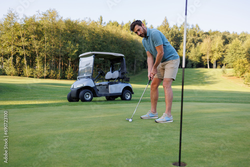On the Verge: Golfer, Cart, and Finishing Hole