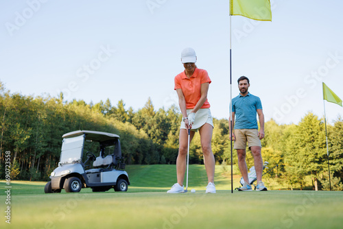 Determined Golfer: Young Woman on Last Hole