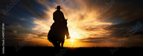 Cowboy on a horse at sunset