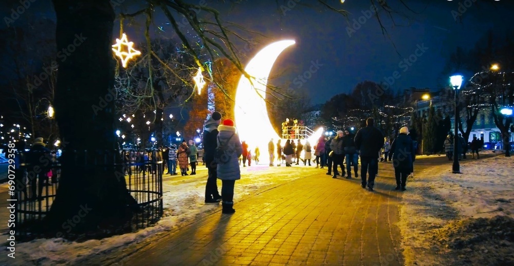 Obraz premium Luminous artistic moon. Amazing and beautiful Christmas artistic lighting – Riga, Latvia.