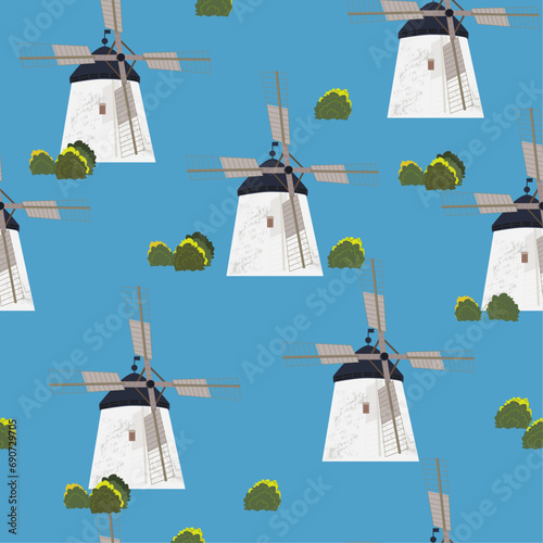Seamless pattern with windmills and bushes on a blue background. vector graphics for fabric, 