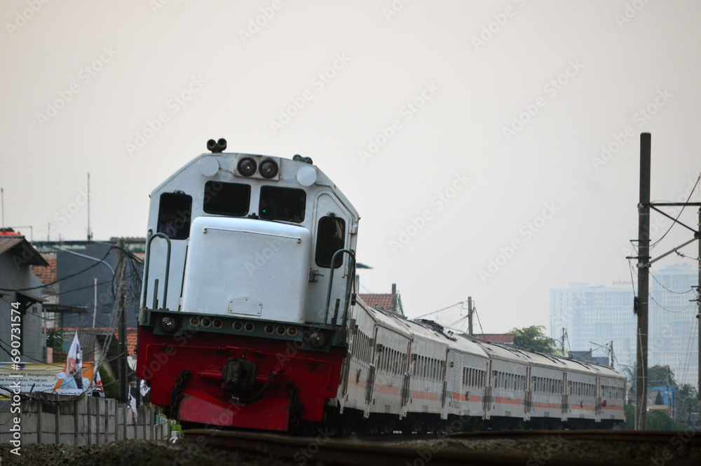 The train is running on the rails towards the destination The train is running on the rails towards the destination