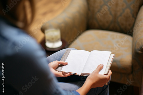 Therapeutic Connection: Close-Up photo of Therapist Holding Notepad in Supportive Consultation.