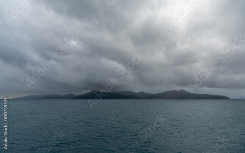 landscape of Elba Island under an overcast and stormy sky