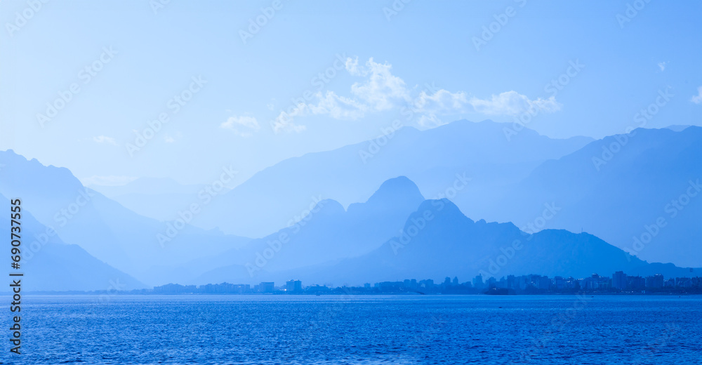  Tranquil scene of a mountainous landscape with blue sky and water