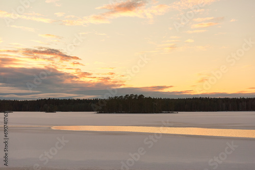 sunset over a lake in winter