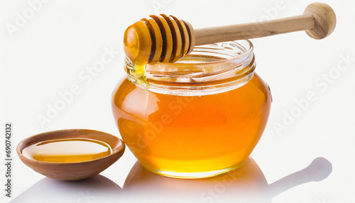 Honey dipper and honey in pot on white background