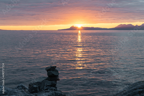 Fototapeta Naklejka Na Ścianę i Meble -  Sunset over the Isle of Eigg from north of Glenuig, Highlands, Scotland