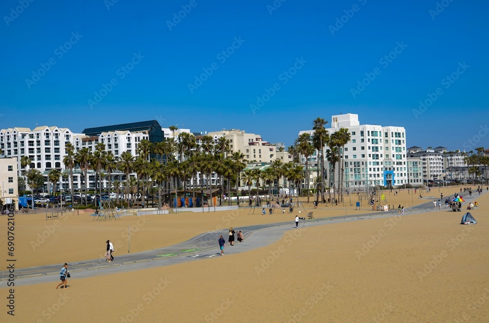 USA California Los Angeles Santa Monica District May 13, 2023 View of the beach with a concrete bike path in Santa Monica from the pier