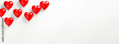 An image of delicate red heart-shaped balloons on white background whit copy space, concept of valentine's day, love, wedding day, anniversary.