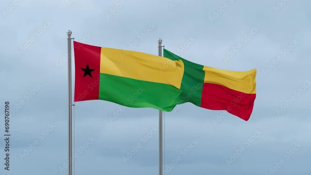 Guinea-Bissau flag and Benin flag waving together on cloudy sky, endless seamless loop Guinea-Bissau flag and Benin flag waving together on cloudy sky, endless seamless loop