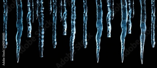 Sharp icicles isolated on b...