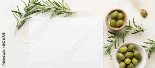 Wedding Table place with invitation card and porcelain plates decorated with olive branches top view Elegant modern template with square blank paper card flat lay Mediterranean mockup copy spac