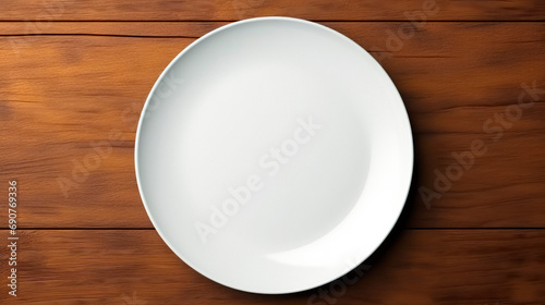 An empty white plate on a wooden table, top view. AI generated