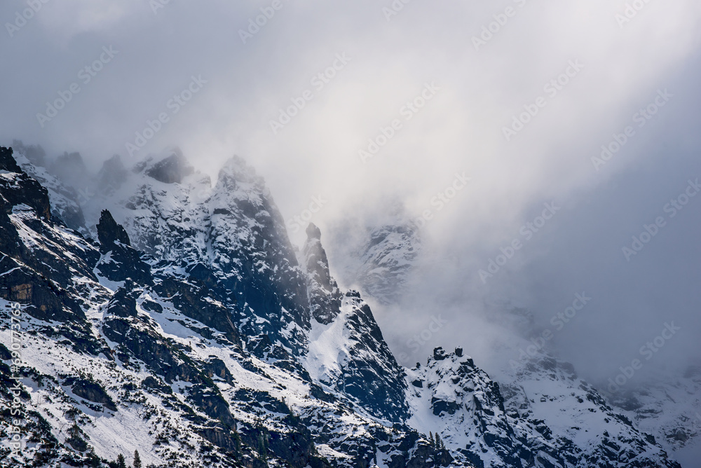 Mountain peaks near Morskie Oko Lake in Poland at Winter. Tatras range - obrazy, fototapety, plakaty 